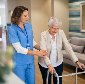 Caregiver helping elderly