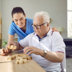 Elderly playing together with Caregiver
