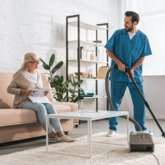 Caregiver cleaning the floor
